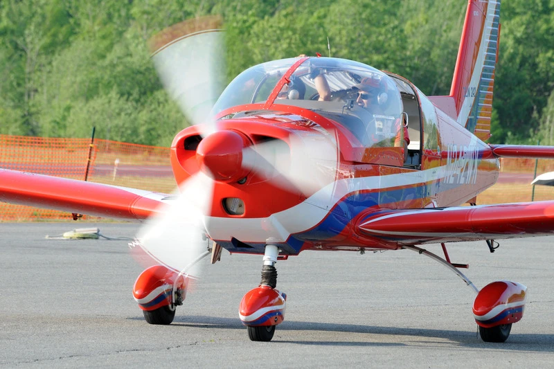 Red and white Zlín Z242L aircraft in the historical GS Finance catalogue