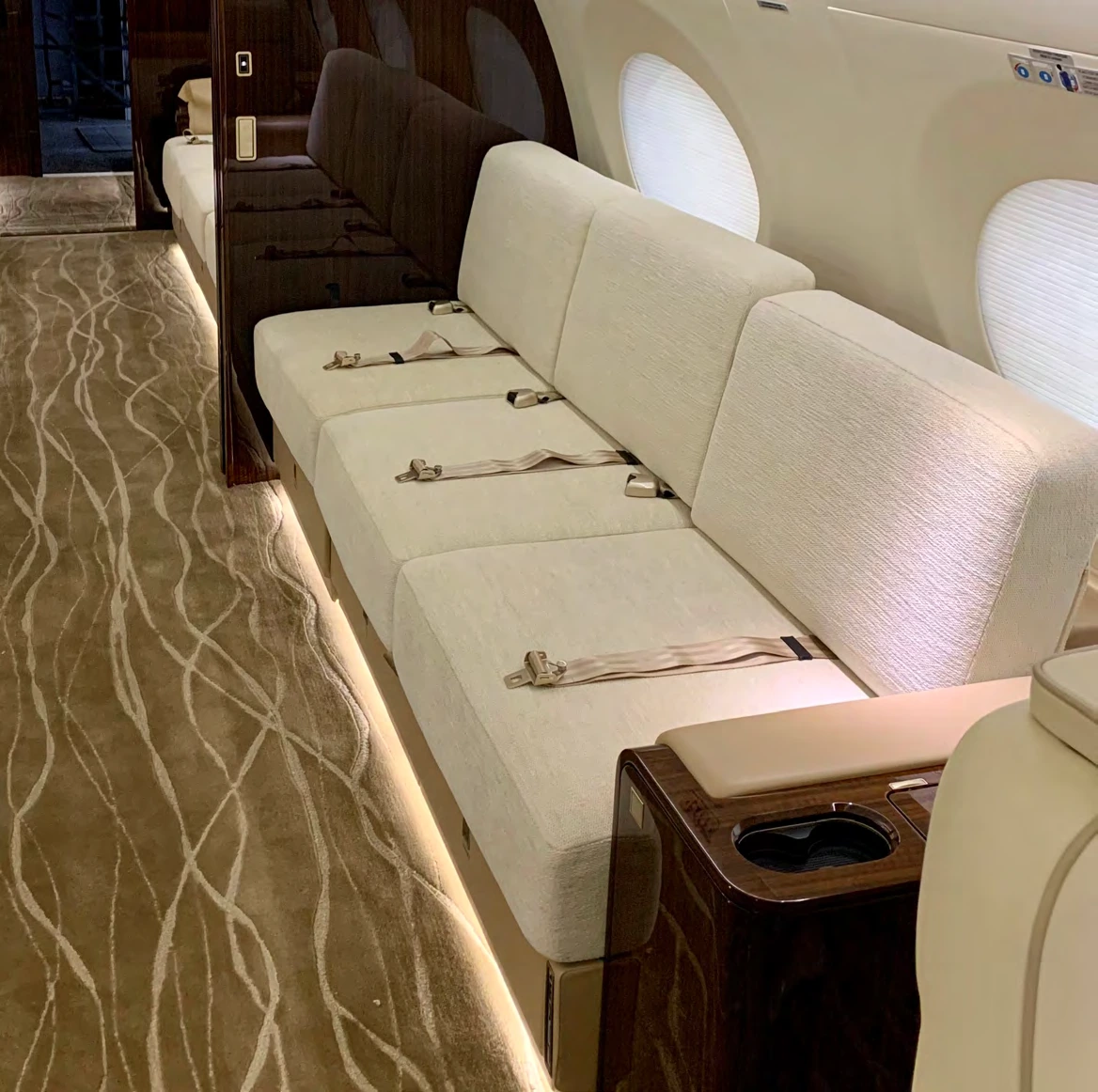 Three-place fabric divan in the mid cabin